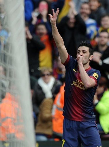 David Villa celebrates after scoring against Getafe at Camp Nou in Barcelona on February 10, 2013