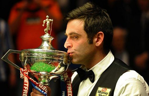 Ronnie O&#039;Sullivan kisses the trophy after winning the World Championships in Sheffield on May 7, 2012