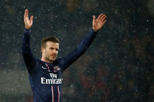 David Beckham waves after a substitute appearance for Paris Saint-Germain on February 24, 2013