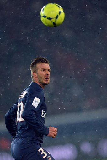 David Beckham eyes the ball during PSG&#039;s game against Olympique de Marseille in Paris on February 24