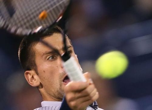 Novak Djokovic returns the ball to Viktor Troicki during their ATP Dubai Open tennis match on February 26, 2013