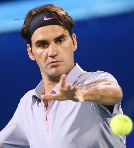 Roger Federer returns the ball at the Dubai Open on February 27, 2013