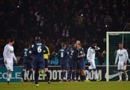 Paris Saint-Germain's players celebrate after scoring the second goal on February 27, 2013 at the Parc-des-Princes