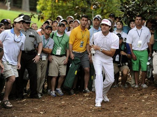 Bubba Watson hits out of the woods on the 10th hole, in Augusta, Georgia, on April 8, 2012