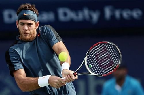 Juan Martin del Potro returns the ball to Daniel Brands during their Dubai Open quarter-final match on February 28, 2013