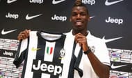 Paul Pogba poses with his new club's shirt after being transferred from Manchester United to Juventus.