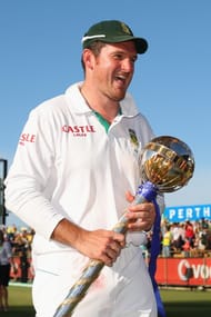 South African captain Graeme Smith walks off the field with the ICC Test Championship mace after winning the series during day four of the Third Test Match between Australia and South Africa