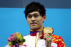 Olympic champ reprimanded for breaking rules