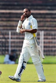 Indian cricketer Shikhar Dhawan walks ou