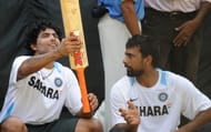 Indian cricketer Ravindra Jadeja (L) and