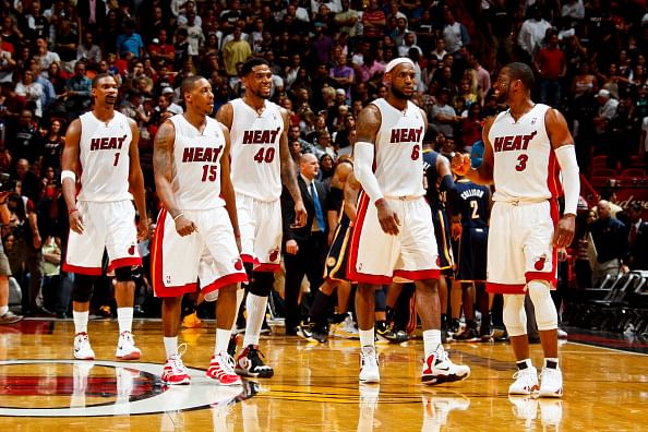 MIAMI, FL - MARCH 10: Miami Heat players Chris Bosh #1, Mario Chalmers #15, Udonis Haslem #40, LeBron James #6, and Dwyane Wade #3 walk during a timeout in their game against the Indiana Pacers on March 10, 2012 at American Airlines Arena in Miami, Florida. NOTE TO USER: User expressly acknowledges and agrees that, by downloading and/or using this Photograph, User is consenting to the terms and conditions of the Getty Images License Agreement. Mandatory copyright notice: Copyright NBAE 2012 (Photo by Issac Baldizon/NBAE via Getty Images)
