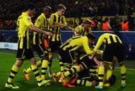 celebrates with team mates after scoring his teams third goal during the UEFA Champions League round of 16 second leg match between Borussia Dortmund and Shakhtar Donetsk at Signal Iduna Park on March 5, 2013 in Dortmund, Germany. (Photo by Lars Baron/Bongarts/Getty Images)