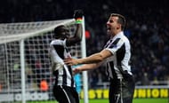NEWCASTLE UPON TYNE, ENGLAND - MARCH 14: Newcastle players Papiss Cisse (l) and Steven Taylor celebrate the winning goal during the UEFA Europa League Round of 16 second leg match between Newcastle United FC and FC Anji Makhachkala at St James' Park on March 14, 2013 in Newcastle upon Tyne, England. (Photo by Stu Forster/Getty Images)