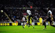 Newcastle player Papiss Cisse (c) heads the winning goal during the UEFA Europa League Round of 16 second leg match between Newcastle United FC and FC Anji Makhachkala at St James' Park on March 14, 2013 in Newcastle upon Tyne, England. (Photo by Stu Forster/Getty Images)