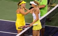 Caroline Wozniacki (R) of Denmark and Angelique Kerber (L) of Germany meet at the net on March 15, 2013 in Indian Wells, California, following Wozniacki's three-set victory in their semirfinal match at the BNP Paribas Open. AFP PHOTO/Frederic J. BROWN (Photo credit should read FREDERIC J. BROWN/AFP/Getty Images)