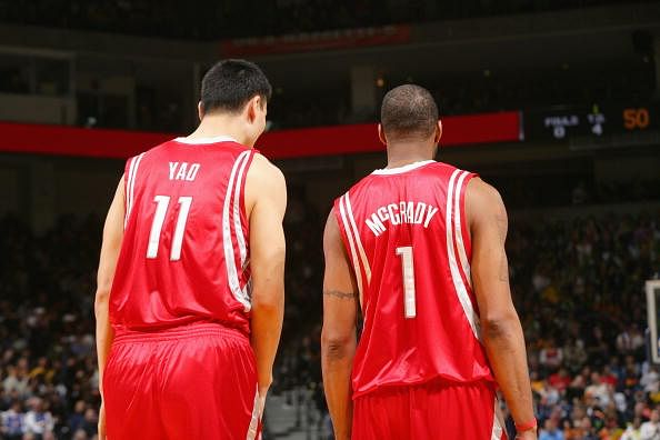 OAKLAND, CA - DECEMBER 12:  Yao Ming #11 and Tracy McGrady #1 of the Houston Rockets stand on court against the Golden State Warriors during the game on December 12, 2008 at Oracle Arena in Oakland, California.  The Rockets won 119-108.  NOTE TO USER: User expressly acknowledges and agrees that, by downloading and/or using this Photograph, user is consenting to the terms and conditions of the Getty Images License Agreement. Mandatory Copyright Notice: Copyright 2008 NBAE  (Photo by Rocky Widner/NBAE via Getty Images)