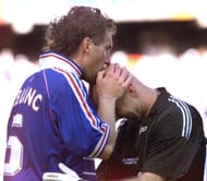 French defender Laurent Blanc (L) kisses