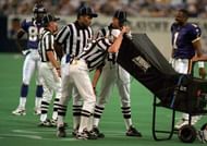 Officials gather to review a play during a National Football League game using the sideline review booth. Instant Replay has been implemented by the NFL in some form since the 1986 season, and has proved to be very successful