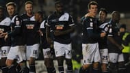 Millwall's English striker John Marquis (2-R) celebrates after scoring the winning goal during the English FA Cup fourth round football match between Millwall and Aston Villa at The Den in south-east London on January 25, 2013. Millwall won 2-1.