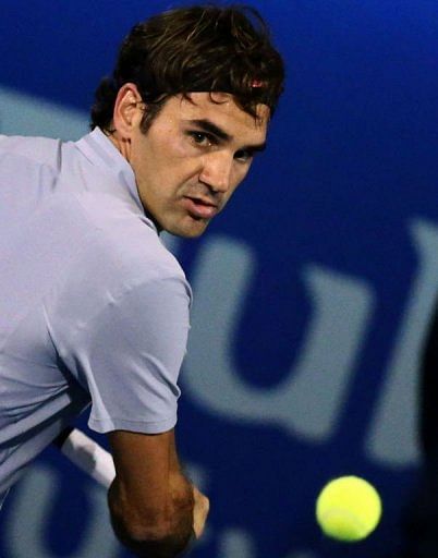 Roger Federer returns the ball at the Dubai Open on February 28, 2013