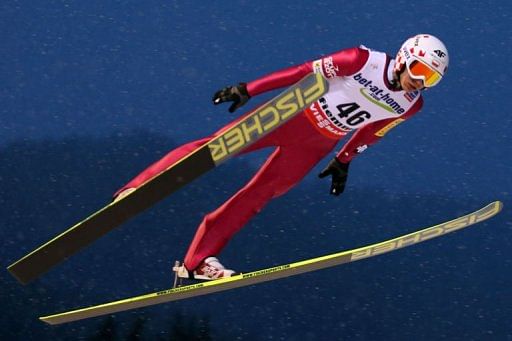 Kamil Stoch soars through the air in Predazzo, north Italy on February 23, 2013