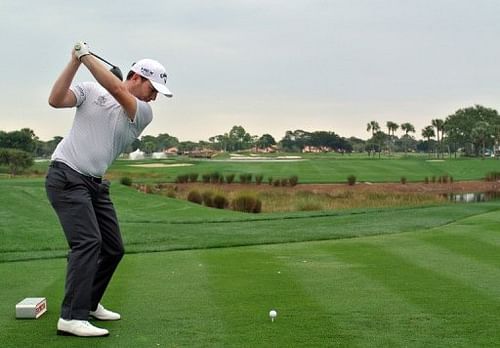 Branden Grace of South Africa plays a tee shot at the Honda Classic on February 28, 2013 in Palm Beach Gardens, Florida