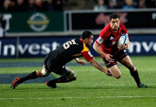 Dan Carter of the Crusaders is being tackled by Liam Messam of the Chiefs, in Hamilton, on July 27, 2012