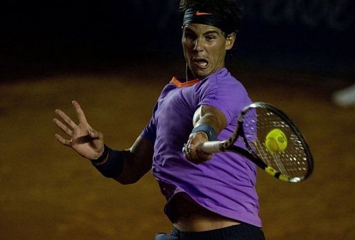 Rafael Nadal of Spain hits a return to Leonardo Mayer of Argentina in Acapulco, Guerrero state on February 28, 2013