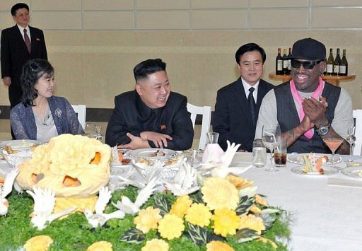 Kim Jong-Un (centre left), his wife Ri Sol-Ju and Dennis Rodman at a dinner in Pyongyang on February 28, 2013