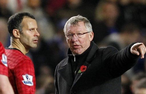 Alex Ferguson (right) gives orders to Ryan Giggs during a game against Chelsea at Stamford Bridge on October 31, 2012