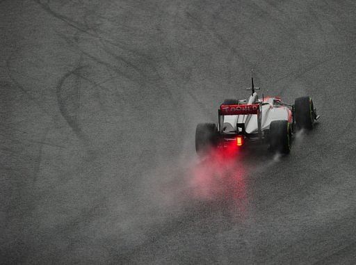 Button sets pace on second day of testing