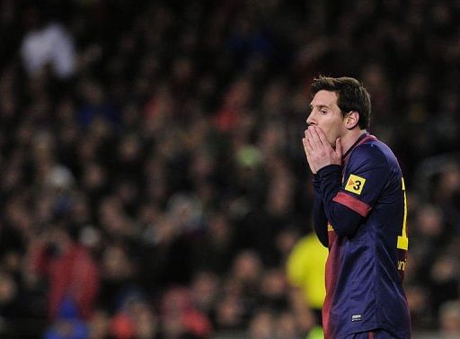 Barcelona&#039;s forward Lionel Messi reacts during their Spanish Cup match against Real Madrid on February 26, 2013