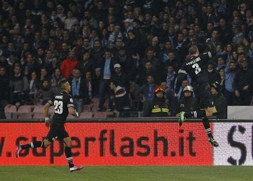 Juventus&#039; defender Giorgio Chiellini (R) celebrates after scoring at San Paolo Stadium in Naples on March 1, 2013