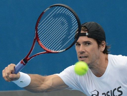 Germany&#039;s Tommy Haas plays a stroke on January 13, 2013