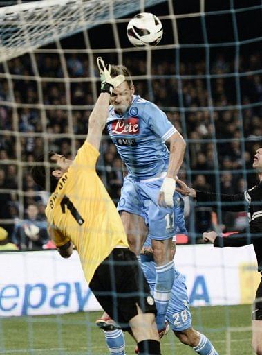 Juventus&#039; goalkeeper Gianluigi Buffon (L) clashes with Napoli&#039;s Christian Maggio in Naples on March 1, 2013