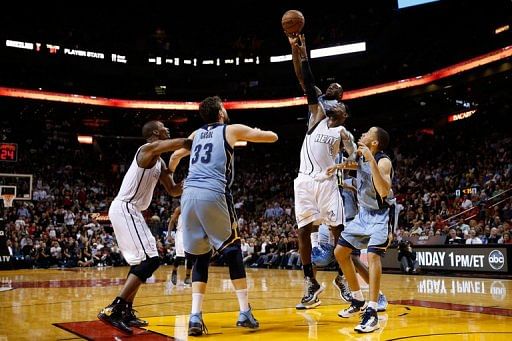 LeBron James of the Miami Heat competes for a rebound with Quincy Pondexter of the Memphis Grizzlies March 1, 2013
