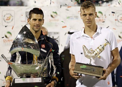 Serbia&#039;s Novak Djokovic (L) and Czech Republic&#039;s Tomas Berdych pose with their trophies, March 2, 2013