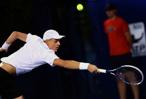 Czech Republic&#039;s Tomas Berdych returns the ball to Serbia&#039;s Novak Djokovic on March 2, 2013