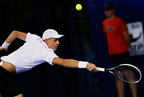 Czech Republic's Tomas Berdych returns the ball to Serbia's Novak Djokovic on March 2, 2013