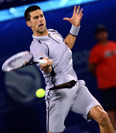 Serbia&#039;s Novak Djokovic returns the ball to Czech Republic&#039;s Tomas Berdych on March 2, 2013