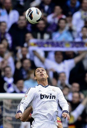 Real Madrid&#039;s forward Cristiano Ronaldo eyes the ball at the Santiago Bernabeu stadium in Madrid on March 2, 2013