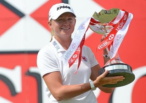 Stacy Lewis holds the trophy after winning the final round of the HSBC Women's Champions in Singapore on March 3, 2013