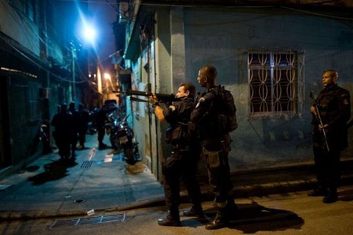 Brazilian BOPE police elite unit personnel patrol in Rio de Janeiro, Brazil, on March 3, 2013