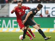 Bayern Munich's Franck Ribery (L) and Hoffenheim's Davis Angel Abraham vie for the ball in Sinsheim on March 3, 2013