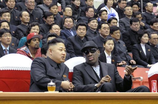 Kim Jong-Un (front L) and Dennis Rodman (front R) speaking at a basketball game in Pyongyang on February 28, 2013