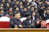 Kim Jong-Un (front L) and Dennis Rodman (front R) speaking at a basketball game in Pyongyang on February 28, 2013