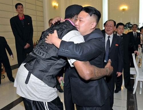 Kim Jong-Un (front R) hugging Dennis Rodman during a dinner in Pyongyang on March 1, 2013