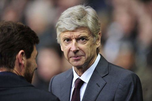 Arsenal manager Arsene Wenger looks on at White Hart Lane in north London on March 3, 2013