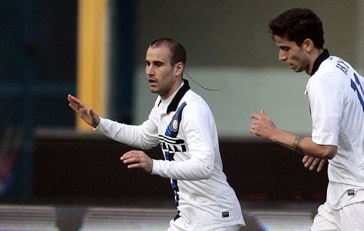 Inter Milan&#039;s Rodrigo Palacio (L) celebrates after scoring on March 3, 2012 at Angelo Massimino stadium in Catania