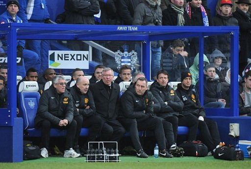 Manchester United&#039;s Alex Ferguson (3rd L) watches a match against Queens Park Rangers in London on February 23, 2013